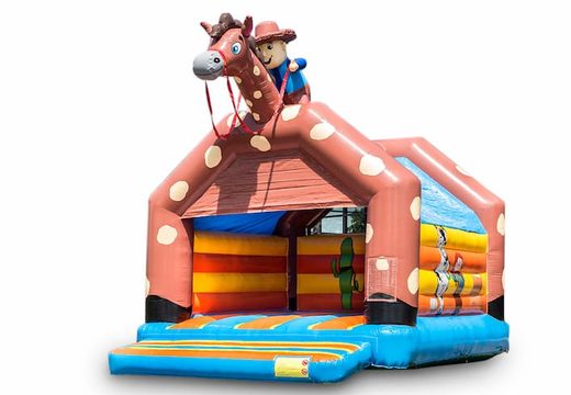 Compre um grande castelo insuflável com tema de cowboy e um telhado para as crianças. Disponível na JB Insufláveis ​​Portugal online
