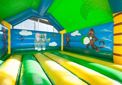 Grande castelo insuflável supercoberto no tema selva com animações alegres para crianças. Encomende castelos insufláveis online na JB Insufláveis ​​Portugal